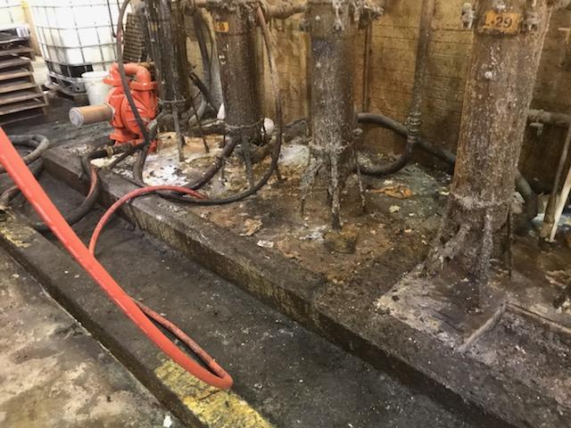 Rusted industrial equipment inside building
