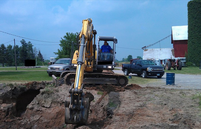 Heavy machinery performing contaminated soil removal