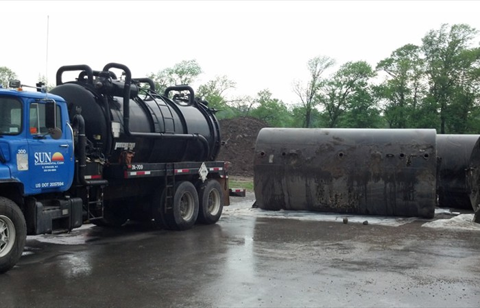 Vacuum truck near storage tanks