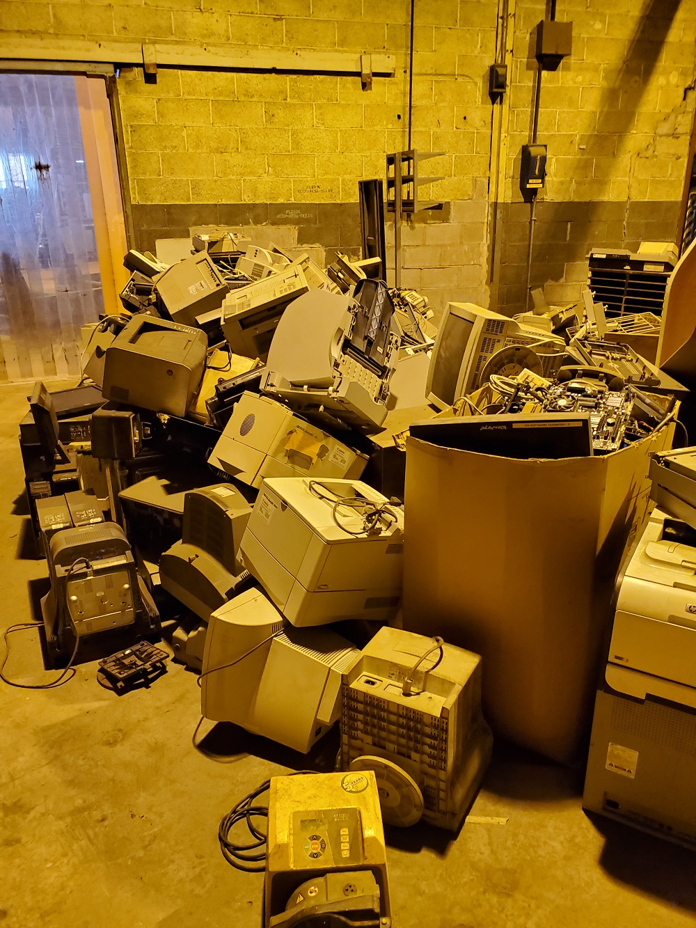 Pile of used computer monitors for disposal